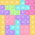 Background of popit tetris bricks - trendy silicon fidget toys. Antistress addictive toy for fidget in pastel colors Royalty Free Stock Photo