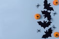 Background postcard Halloween. Paper decor bats, spiders and pumpkins on a blue background Royalty Free Stock Photo