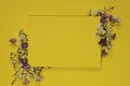 Background, postcard. Yellow background with white and lilac wildflowers, in the center is a clean yellow sheet of paper.