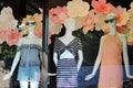 Three female mannequins dressed in springtime fashion and set in storefront windows, Saratoga, New York, 2018