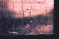 Background raindrop on window glass pink