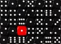Background of random ordered black dices with one red cube Royalty Free Stock Photo
