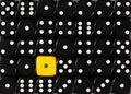 Background of random ordered black dices with one yellow cube Royalty Free Stock Photo