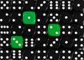 Background of random ordered black dices with three green cubes Royalty Free Stock Photo