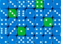 Background of random ordered blue dices with four green cubes