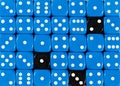 Background of random ordered blue dices with three black cubes Royalty Free Stock Photo