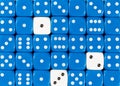 Background of random ordered blue dices with three white cubes Royalty Free Stock Photo
