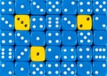 Background of random ordered blue dices with three yellow cubes Royalty Free Stock Photo