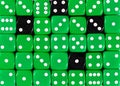 Background of random ordered green dices with four black cubes Royalty Free Stock Photo