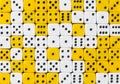 Background of 70 random ordered white and yellow dices Royalty Free Stock Photo