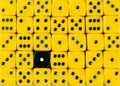 Background of random ordered yellow dices with one black cube Royalty Free Stock Photo