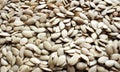 Background with raw hulled pumpkin seeds close-up Royalty Free Stock Photo