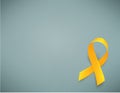 Background with realistic yellow ribbon. World childhood cancer awareness symbol, vector illustration. Royalty Free Stock Photo