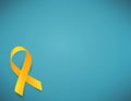 Background with realistic yellow ribbon. World childhood cancer awareness symbol, vector illustration. Royalty Free Stock Photo