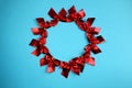 Background red bows on a blue background folded in a circle Royalty Free Stock Photo