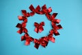 Background red bows on a blue background folded in a circle Royalty Free Stock Photo