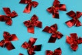 Background red bows on a blue background texture Royalty Free Stock Photo