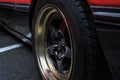 Background  red old racing car on stylish titanium rims Royalty Free Stock Photo