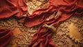 background of red raw canvas fabric with golden embroidered arabesques folded into sinuous curves