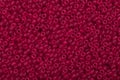 Background of red seed beads. Royalty Free Stock Photo