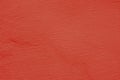 Background of a red stucco coated and painted exterior, rough cast of cement and concrete wall texture Royalty Free Stock Photo