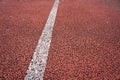 Background of Red treadmill with white line. Polyurethane flooring. Royalty Free Stock Photo