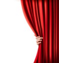 Background with red velvet curtain and hand.