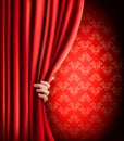 Background with red velvet curtain and hand