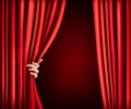 Background with red velvet curtain and hand.