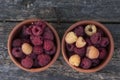 Red and yellow raspberries in a cup Royalty Free Stock Photo