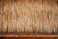 background of reed rods and a wooden bar stand, blank space, concept of refreshing drinks on the beach