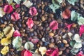 background of roasted coffee beans with colourful dried Potpourri Royalty Free Stock Photo