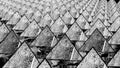 background from rows of black and white cracked pyramids. abstract three-dimensional composition. 3d render
