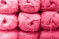 background of rows skeins of fluffy wool yarn for knitting soft red pink purple hue colors. toned in viva magenta Royalty Free Stock Photo
