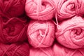 background of rows skeins of fluffy wool yarn for knitting soft red pink purple hue colors. toned in viva magenta Royalty Free Stock Photo