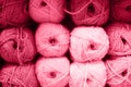 background of rows skeins of fluffy wool yarn for knitting soft red pink purple hue colors. toned in viva magenta Royalty Free Stock Photo