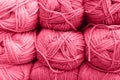 background of rows skeins of fluffy wool yarn for knitting soft red pink purple hue colors. toned in viva magenta Royalty Free Stock Photo