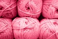 background of rows skeins of fluffy wool yarn for knitting soft red pink purple hue colors. toned in viva magenta Royalty Free Stock Photo