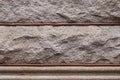 Background of rusticated granite blocks divided by beaded mortar, architectural details Royalty Free Stock Photo