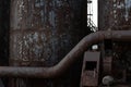Background of rusting metal industrial shapes and textures, tubes and columns