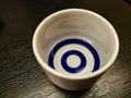 Ceramics glass of sake on wood table. Royalty Free Stock Photo