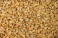 A background of salted roasted peanuts. Lots of peeled peanuts, top view. Royalty Free Stock Photo