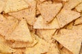 background of salted yellow tortilla chips maed with corn