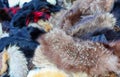 background of scraps of animal fur stoles for sale in the luxury furrier
