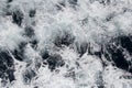 Background of the sea. Sea, ocean, wave. Beautiful view of the bubbling and splashing sea water and foam in the blue sea Royalty Free Stock Photo