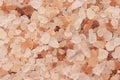 Background of sea salt. Aromatic bright orange crystals of large salt. Colorful background for spa Royalty Free Stock Photo