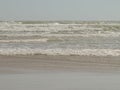 Background. Sea waves with foam ranning on the sandy beach Royalty Free Stock Photo