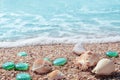 Background with seashells, glass pebbles and the sea