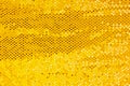 Sparkling golden sequin textile background, fabric, sequins on fabric, fabric embroidered sequins Royalty Free Stock Photo