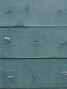 Background of shabby horizontal boards painted with green paint. Fragment of wooden shutters of an old house in Herceg Royalty Free Stock Photo